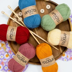 Drops Flora yarn balls and knitting yarn