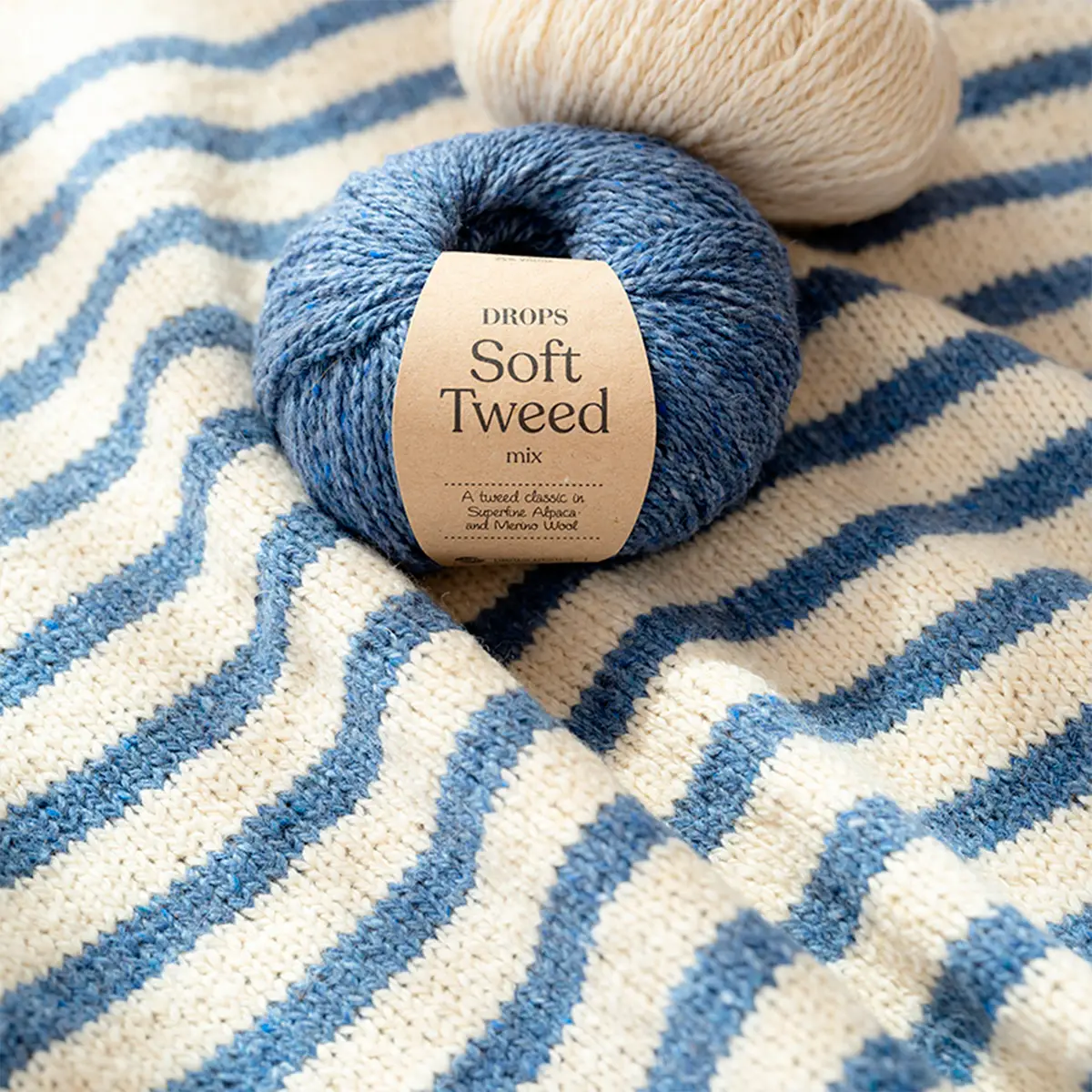 Drops Soft Tweed yarn knitted in stripes